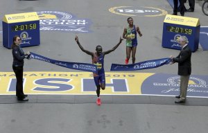 Lawrence Cherono, of Kenya, breaks the tape to win the 123rd Boston Marathon in front of Lelisa Desisa, of Ethiopia, right, on Monday, April 15, 2019, in Boston. (AP Photo/Charles Krupa)Lawrence Cherono, of Kenya, breaks the tape to win the 123rd Boston Marathon in front of Lelisa Desisa, of Ethiopia, right, on Monday, April 15, 2019, in Boston. (AP Photo/Charles Krupa)