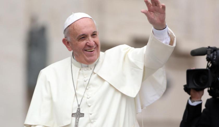 Pope Francis waves to onlookers. (Credit: CBS News)