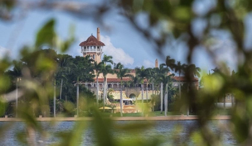 FILE - This Nov. 23, 2018 file photo shows President Donald Trump's Mar-a-Lago estate behind mangrove trees in Palm Beach, Fla. On Saturday, March 30, 2019, a woman carrying two Chinese passports and a device containing computer malware lied to Secret Service agents and briefly gained admission to the club over the weekend during his Florida visit, federal prosecutors allege in court documents. (AP Photo/J. David Ake)