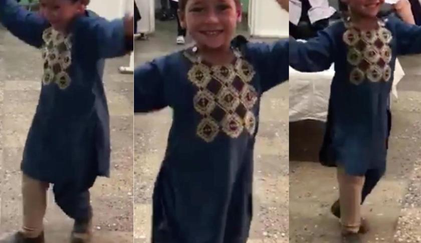 Boy who lost leg from landmine in Afghanistan dances after receiving prosthetic limb. (Credit: CBS News)