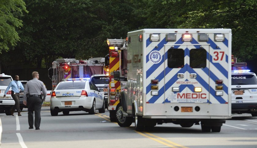 Emergency vehicles cluster on Mary Alexander Road on the campus of University of North Carolina at Charlotte after a shooting Tuesday, April 30, 2019, in Charlotte, N.C. The shooting on the campus left at least a few people dead and several wounded Tuesday, prompting a lockdown and chaotic scene in the state's largest city. (John Simmons/The Charlotte Observer via AP)