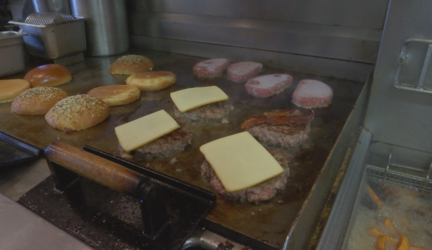 Food sizzles on the grill. (Credit: WINK News)