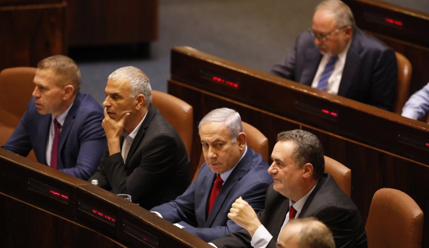 Israeli Prime Minister Benjamin Netanyahu before voting in the Knesset, Israel's parliament in Jerusalem, Wednesday, May 29, 2019. Israeli Prime Minister Benjamin Netanyahu faced a deadline at midnight Wednesday to form a new governing coalition as he tried to stave off a crisis that could trigger an unprecedented second election this year or even force the longtime leader to step down. (AP Photo/Sebastian Scheiner)