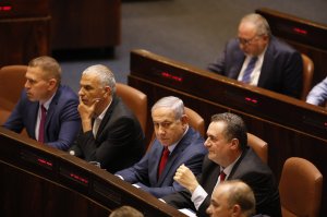Israeli Prime Minister Benjamin Netanyahu before voting in the Knesset, Israel's parliament in Jerusalem, Wednesday, May 29, 2019. Israeli Prime Minister Benjamin Netanyahu faced a deadline at midnight Wednesday to form a new governing coalition as he tried to stave off a crisis that could trigger an unprecedented second election this year or even force the longtime leader to step down. (AP Photo/Sebastian Scheiner)