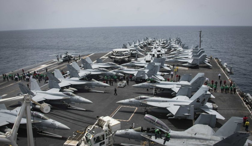 In this Sunday, May 19, 2019, photo released by the U.S. Navy, sailors partake in a foreign object and debris walk-down on the flight deck of the Nimitz-class aircraft carrier USS Abraham Lincoln in the Arabian Sea. (Mass Communication Specialist 3rd Class Garrett LaBarge/U.S. Navy via AP)