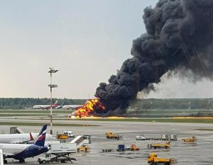 In this image provided by Riccardo Dalla Francesca shows smoke rises from a fire on a plane at Moscow's Sheremetyevo airport on Sunday, May 5, 2019. (Riccardo Dalla Francesca via AP)