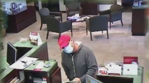 Suspected bank robber slips note to teller. (Credit: WINK News)