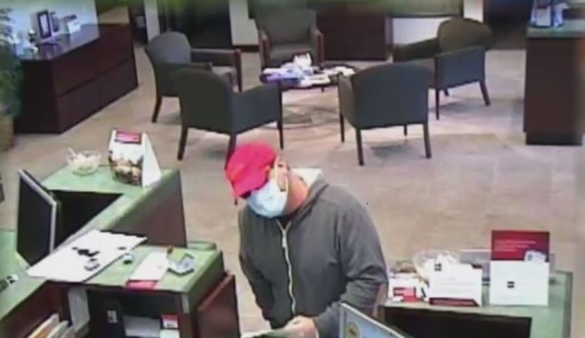 Suspected bank robber slips note to teller. (Credit: WINK News)