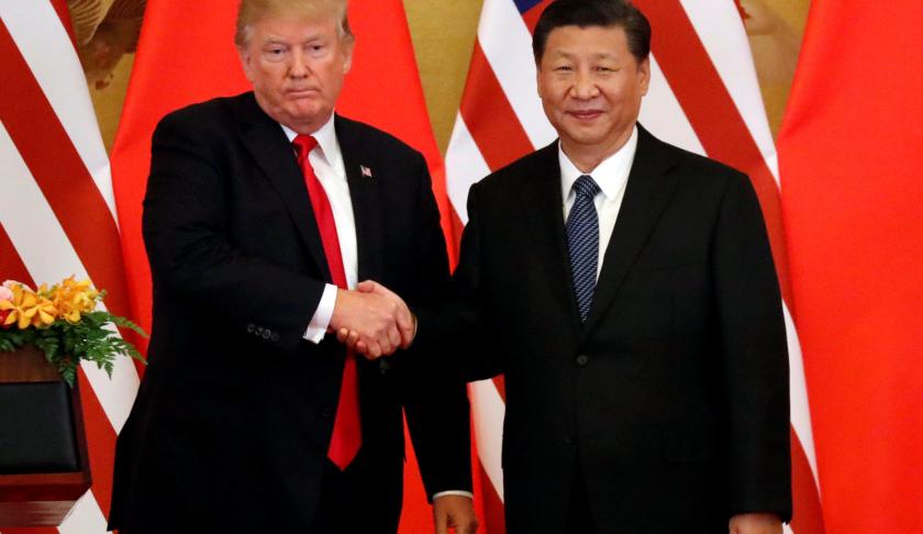 U.S. President Donald Trump and China's President Xi Jinping shake hands. (Credit CBS News)