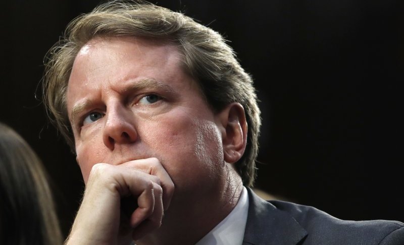 FILE - In this Sept. 4, 2018 file photo, White House counsel Don McGahn, listens as he attends a confirmation hearing for Supreme Court nominee Brett Kavanaugh before the Senate Judiciary Committee on Capitol Hill in Washington. (AP Photo/Jacquelyn Martin)