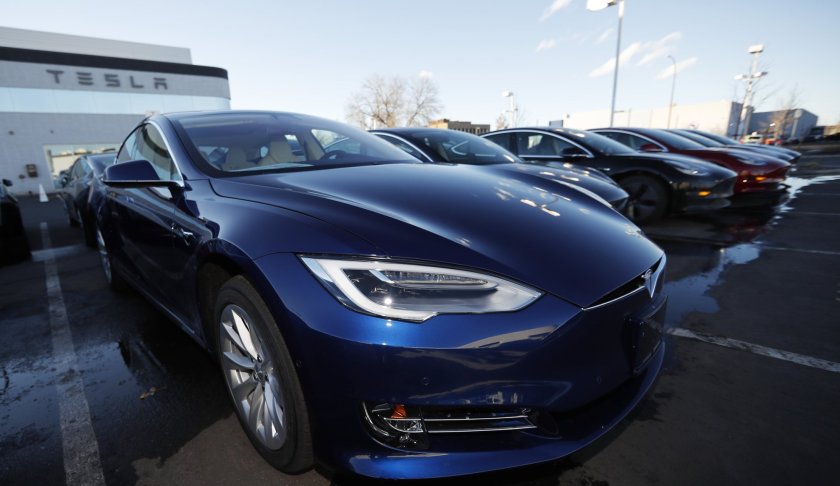 FILE - In this Sunday, Feb. 3, 2019, file photograph, an unsold 2019 S75D sits at a Tesla dealership in Littleton, Colo. Rising trade tensions have sparked worries about the 17 exotic-sounding rare minerals needed for high-tech products like robotics, drones and electric cars. China recently raised tariffs to 25% on rare earth exports to the U.S. and has threatened to halt exports altogether after the Trump administration raised tariffs on Chinese products and blacklisted telecommunications giant Huawei. (AP Photo/David Zalubowski, File)