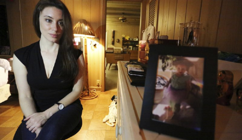 Casey Anthony poses for a portrait next to a photo of her daughter, Caylee, in her West Palm Beach, Fla., bedroom. (AP Photo/Joshua Replogle).