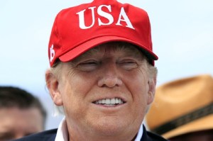 FILE - In this March 29, 2019 file photo, President Donald Trump speaks to reporters during a visit to Lake Okeechobee and Herbert Hoover Dike at Canal Point, Fla. Florida was a bright spot for Republicans in an otherwise bleak 2018, seemingly immune to headwinds faced by the GOP in other historic battlegrounds from President Donald Trump’s tumultuous presidency. But ahead of the 2020 election, Democrats aren’t giving up hope on the Sunshine State, seeking to inject new peril to Trump’s path to another term in office. (AP Photo/Manuel Balce Ceneta)