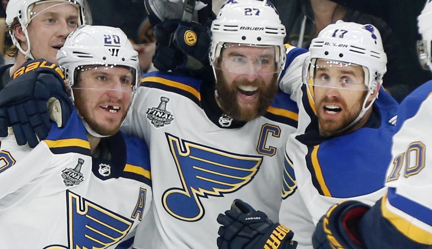 St. Louis Blues' Alex Pietrangelo, second from right, celebrates his goal with teammates Jay Bouwmeester, left rear, Alexander Steen, left, and Jaden Schwartz, right, during the first period in Game 7 of the NHL hockey Stanley Cup Final, Wednesday, June 12, 2019, in Boston. (AP Photo/Michael Dwyer)