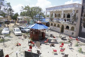 A view of Asasey Hotel after an attack, in Kismayo , Somalia, Saturday July 13, 2019. At least 10 people, including two journalists, were killed in an extremist attack Friday on a hotel in the port city of Kismayo, a Somali official said. The attack started with a suicide car bomb blast and then gunmen stormed into the hotel. (AP Photo)