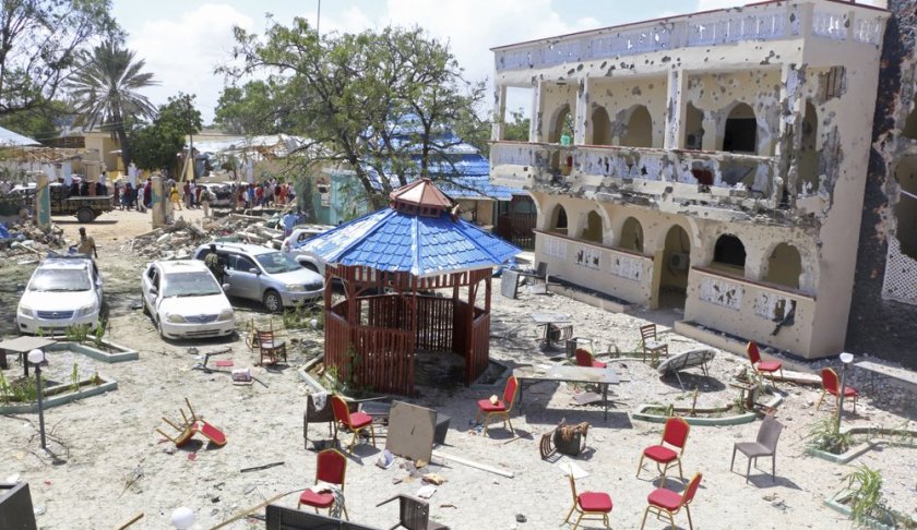 A view of Asasey Hotel after an attack, in Kismayo , Somalia, Saturday July 13, 2019. At least 10 people, including two journalists, were killed in an extremist attack Friday on a hotel in the port city of Kismayo, a Somali official said. The attack started with a suicide car bomb blast and then gunmen stormed into the hotel. (AP Photo)