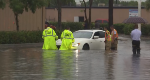 Car stuck in the water at Fowler St. in Fort Myers. (Credit: WINK News)