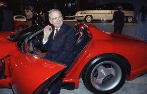 FILE - In this March 28, 1990, file photo, Chrysler Corporation Chairman Lee Iacocca sits in a 1990 Dodge Viper sports car as the Chrysler in the 90's six city tour makes a visit to New York. Former Chrysler CEO Iacocca, who became a folk hero for rescuing the company in the '80s, has died, former colleagues said Tuesday, July 2, 2019. He was 94. (AP Photo/Osamu Honda, File)