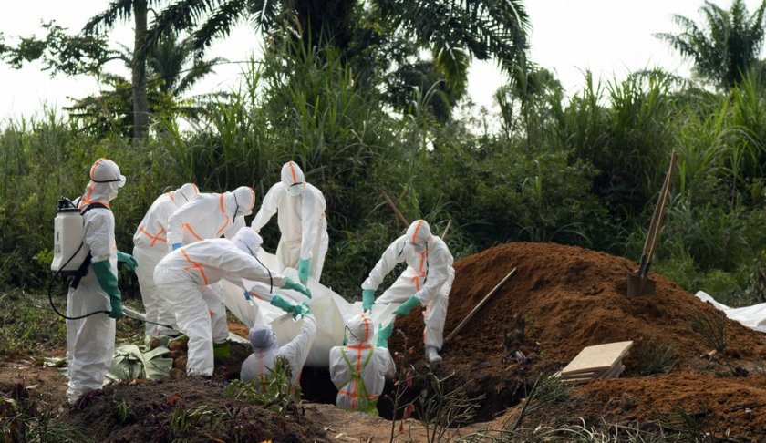 In this photograph taken Sunday July 14, 2019, an Ebola victim is put to rest at the Muslim cemetery in Beni, Congo DRC. The head of the World Health Organization is convening a meeting of experts Wednesday July 17, 2019 to decide whether the Ebola outbreak should be declared an international emergency after spreading to eastern Congo's biggest city, Goma, this week. More than 1,600 people in eastern Congo have died as the virus has spread in areas too dangerous for health teams to access. (AP Photo/Jerome Delay)