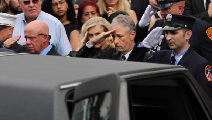 Jon Stewart salutes fallen first responder. (Credit: CBS News)