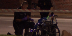 Officer investigating the area around the disabled veteran's wheelchair. (Credit: CBS)