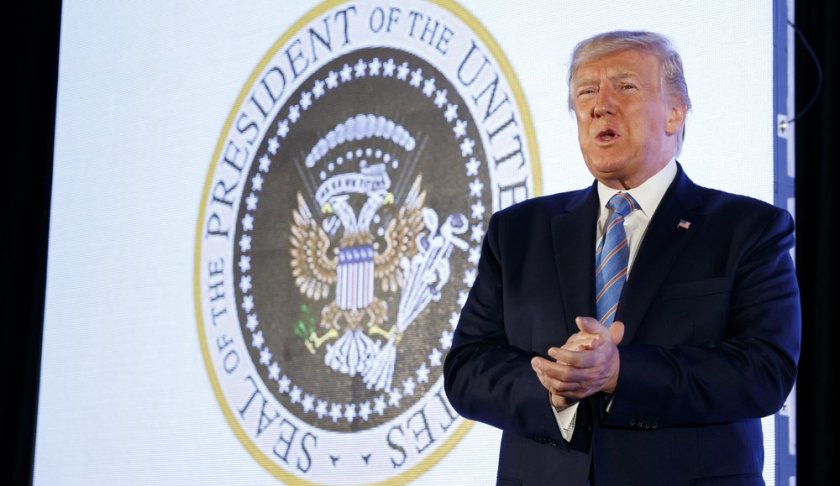 President Donald Trump arrives to speak, with an altered presidential seal behind him, at Turning Point USA's Teen Student Action Summit 2019, Tuesday, July 23, 2019, in Washington. (AP Photo/Alex Brandon)