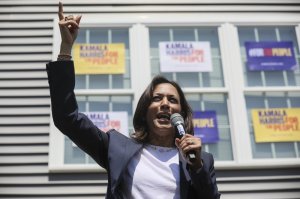 Supporters applaud as Democratic presidential candidate, U.S. Sen. Kamala Harris, D-Calif., gestures while speaking at a house party in Gilford, N.H., Sunday, July 14, 2019. (AP Photo/ Cheryl Senter)