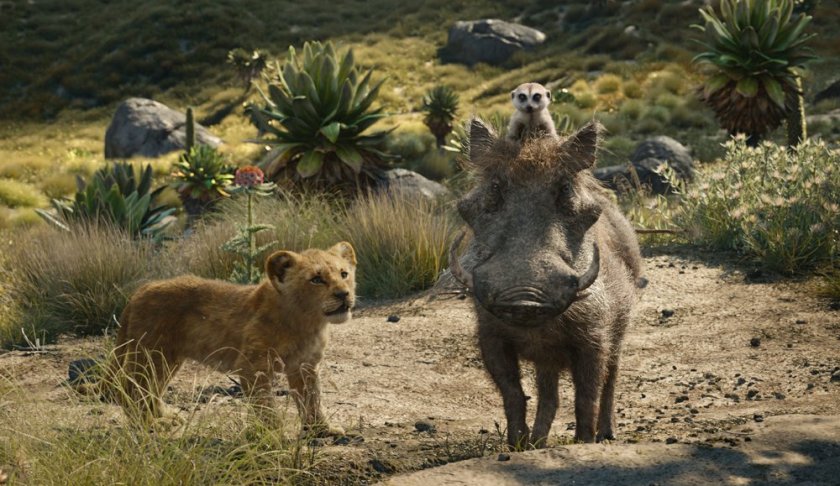 FILE - This file image released by Disney shows, from left, young Simba, voiced by JD McCrary, Timon, voiced by Billy Eichner, and Pumbaa, voiced by Seth Rogen, in a scene from "The Lion King." The Walt Disney Co. is ruling the box office again with the record-breaking debut of “The Lion King” this weekend. The studio says Sunday, July 21, 2019 that the photorealistic remake devoured an estimated $185 million in ticket sales from 4,725 North American locations. It’s a record for the month of July, PG-rated films and the ninth highest opening of all time.(Disney via AP, File)