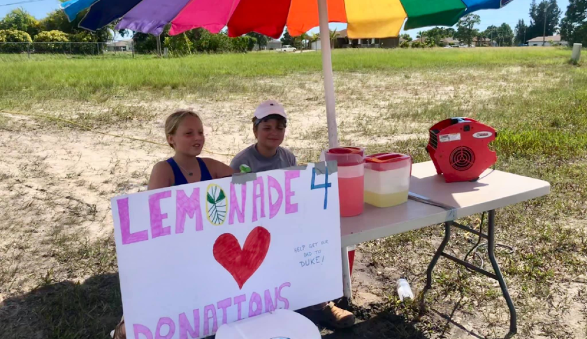 Two Cape Coral kids put up a lemon stand to help get their dad to Duke. (Credit: WINK News)