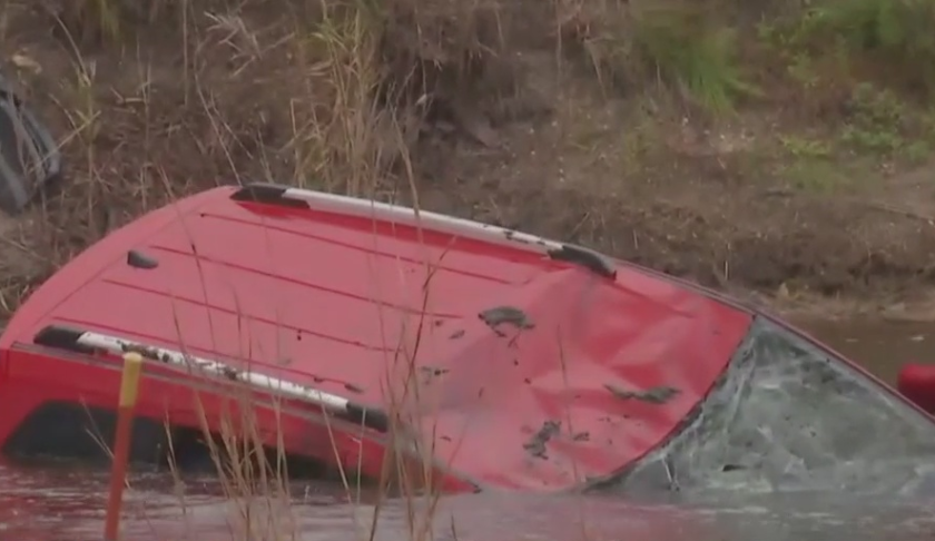 Vehicle sinks into a canal at Golden Gate Estates. (Credit: WINK News)