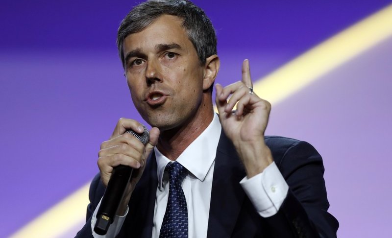 FILE - In this July 24, 2019, file photo, Democratic presidential candidate former Texas Rep. Beto O'Rourke, speaks during a candidates forum at the 110th NAACP National Convention in Detroit. As the U.S. economy flashes recession warning signs, Democratic presidential candidates are leveling pre-emptive blame on President Donald Trump. They argue that his aggressive and unpredictable tariff policies are to blame for gloomy economic forecasts. (AP Photo/Carlos Osorio)
