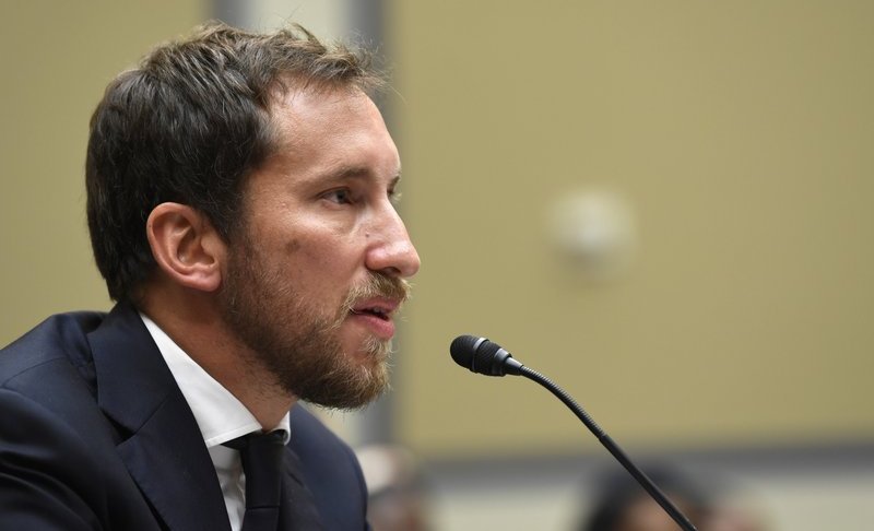 FILE - In this July 25, 2019, file photo, JUUL Labs co-founder and Chief Product Officer James Monsees testifies before a House Oversight and Government Reform subcommittee on Capitol Hill in Washington. Juul Labs gave nearly $100,000 to members of Congress during the first half of 2019 as the company faced the bulk of the blame for a surge of underage vaping and calls for tighter government regulation of the industry.(AP Photo/Susan Walsh, File)