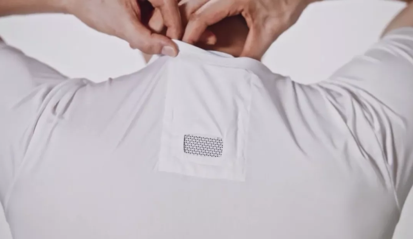 Man places device on 'air conditioner' shirt. (Credit: Sony)