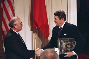 FILE - In this Dec. 8, 1987, file photo, President Ronald Reagan, right, shakes hands with Soviet leader Mikhail Gorbachev after the two leaders signed the Intermediate Range Nuclear Forces Treaty to eliminate intermediate-range missiles during a ceremony in the White House East Room in Washington. The landmark arms control treaty that Reagan and Gorbachev signed three decades ago is dead. The U.S. and Russia both walked away from the deal on Friday, Aug. 2, 2019. (AP Photo/Bob Daugherty, File)