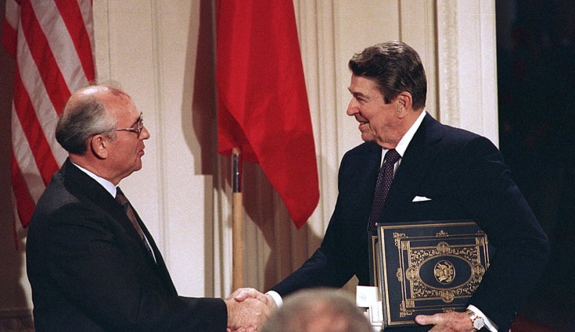 FILE - In this Dec. 8, 1987, file photo, President Ronald Reagan, right, shakes hands with Soviet leader Mikhail Gorbachev after the two leaders signed the Intermediate Range Nuclear Forces Treaty to eliminate intermediate-range missiles during a ceremony in the White House East Room in Washington. The landmark arms control treaty that Reagan and Gorbachev signed three decades ago is dead. The U.S. and Russia both walked away from the deal on Friday, Aug. 2, 2019. (AP Photo/Bob Daugherty, File)