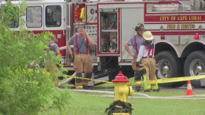 Scene from the fire around the NW Cape Coral home on Wednesday. (Credit: WINK News)