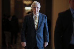 Senate Majority Leader Mitch McConnell, R-Ky., walks to the Senate chamber for votes on federal judges as a massive budget pact between House Speaker Nancy Pelosi and President Donald Trump is facing a key vote in the GOP-held Senate later, at the Capitol in Washington, Wednesday, July 31, 2019. Many conservatives in the Republican-led Senate are torn between supporting President Donald Trump and risking their political brand with an unpopular vote to add $2 trillion or more to the federal debt. (AP Photo/J. Scott Applewhite)