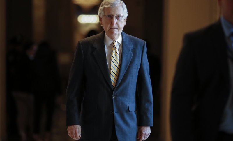 Senate Majority Leader Mitch McConnell, R-Ky., walks to the Senate chamber for votes on federal judges as a massive budget pact between House Speaker Nancy Pelosi and President Donald Trump is facing a key vote in the GOP-held Senate later, at the Capitol in Washington, Wednesday, July 31, 2019. Many conservatives in the Republican-led Senate are torn between supporting President Donald Trump and risking their political brand with an unpopular vote to add $2 trillion or more to the federal debt. (AP Photo/J. Scott Applewhite)