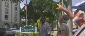 Senior points towards the Royal Palm Towers building. (Credit: WINK News)
