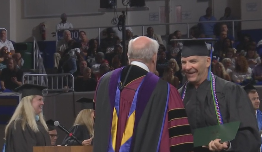 The former cop receives his diploma. (Credit: WINK News)