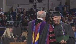 The former cop receives his diploma. (Credit: WINK News)