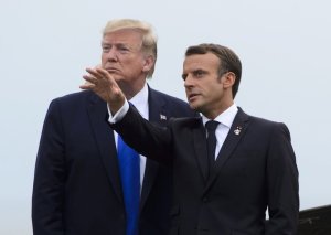 U.S. President Donald Trump, left, is greeted by President of France Emmanuel Macron as he arrives to the G7 Summit in Biarritz, France, Saturday, Aug. 24, 2019. (Sean Kilpatrick/The Canadian Press via AP)