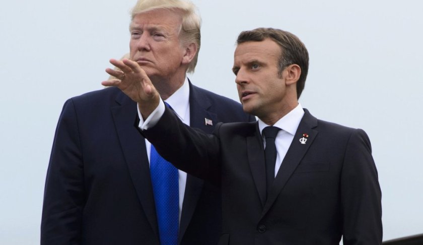U.S. President Donald Trump, left, is greeted by President of France Emmanuel Macron as he arrives to the G7 Summit in Biarritz, France, Saturday, Aug. 24, 2019. (Sean Kilpatrick/The Canadian Press via AP)