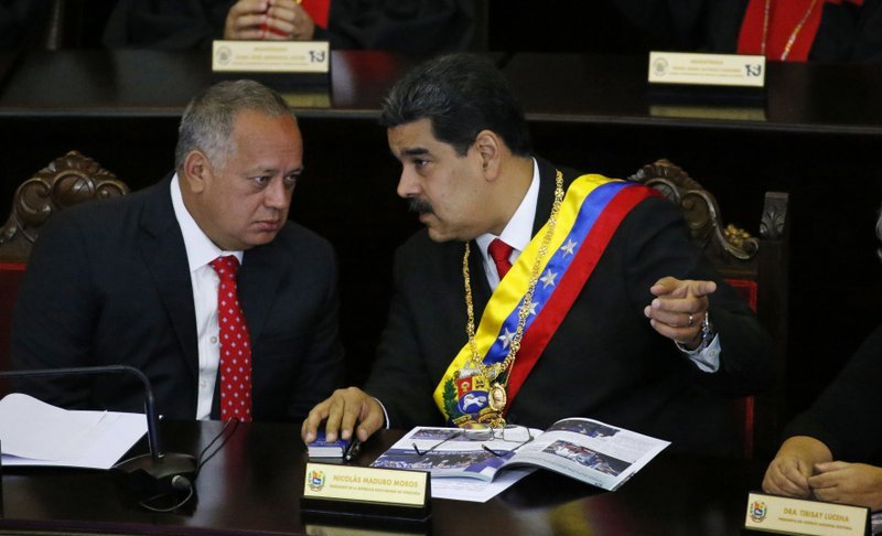 FILE - In this Jan. 24, 2019 file photo, Venezuelan President Nicolas Maduro, right, speaks with Constitutional Assembly President Diosdado Cabello at the Supreme Court during an annual ceremony that marks the start of the judicial year in Caracas, Venezuela. The U.S. has opened up secret communications with Cabello as members of Maduro’s inner circle seek guarantees they won’t face retribution if they cede to growing demands to remove him, a senior administration official told The Associated Press on Saturday, Aug. 17, 2019. (AP Photo/Ariana Cubillos, File)