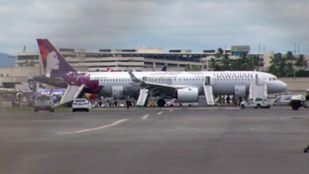 Hawaiian Airlines flight is seen following emergency landing in Honolulu after smoke filled its cabin and cargo hold on Auguest 22, 2019 (KGMB-TV via CBS)