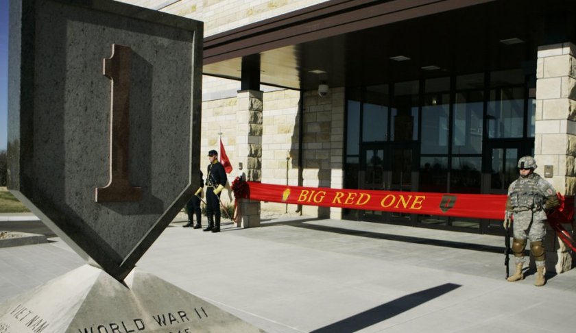 FILE - In this Feb. 9, 2015 file photo, an honor guard stands at the entrance before ribbon cutting ceremonies for the new 1st Infantry Division Headquarters at Fort Riley, Kan. Prosecutors say a U.S. Army infantry soldier stationed at Fort Riley shared bomb-making instructions online and also discussed killing activists and bombing a news network. The Justice Department says Monday, Sept. 23, 2019, that private first class Jarrett William Smith was charged with distributing information related to explosives and weapons of mass destruction. (AP Photo/Orlin Wagner File)