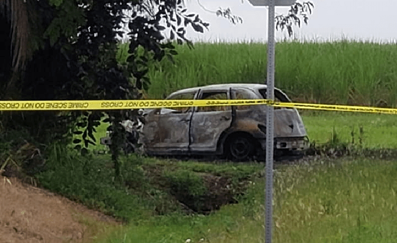 Charred car where a woman may have died. (Credit: WINK News)