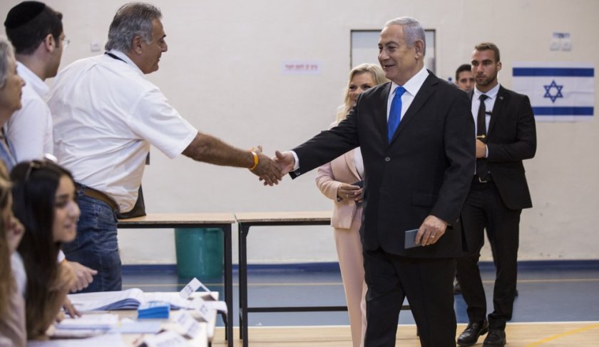 Israeli Prime Minister Benjamin and his wife Sarah arrive at a voting station in Jerusalem on September 17, 2019. Israelis began voting Tuesday in an unprecedented repeat election that will decide whether longtime Prime Minister Benjamin Netanyahu stays in power despite a looming indictment on corruption charges. (Heidi Levine, Sipa, Pool via AP).