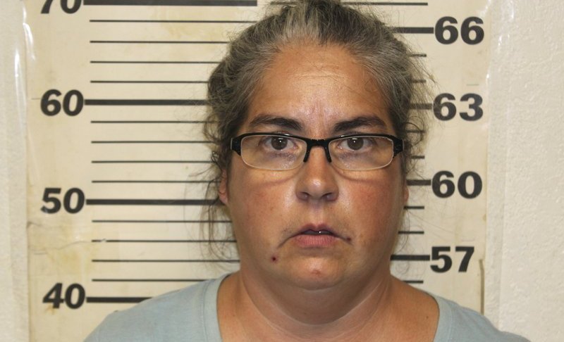 This undated photo provided by the Benton County, Mo., Sheriff's Office in Warsaw, Mo., shows Tiffany Woodington, whe was charged Friday, Sept. 20, 2019, in Missouri with 10 counts of felony animal abuse and two misdemeanor counts of animal abuse. Her husband, Steven Woodington, was charged Thursday in Texas with animal cruelty. A second man described as the caretaker also was charged in Texas with animal cruelty. All three are free on bond. face multiple charges after 120 dogs and a cat were found dead in Missouri and about two dozen more dogs died in Texas. More than 200 other animals were rescued from conditions that law enforcement described as "inhumane and unimaginable." (Benton County Sheriff's Office via AP)