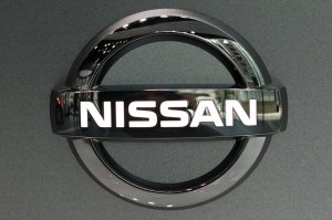 FILE - In this July 25, 2019, file, photo, Nissan logo is seen at a Nissan car gallery in Tokyo. Nissan Chief Executive Hiroto Saikawa tendered his resignation Monday, Sept. 9, 2019, after acknowledging that he had received dubious income and vowed to pass the leadership of the Japanese automaker to a new generation. Board member Yasushi Kimura told reporters at an evening news conference at company headquarters in Yokohama that the board has approved Saikawa's resignation, effective Sept. 16, and a successor will be appointed next month. A search is underway, he added.(AP Photo/Eugene Hoshiko, File)